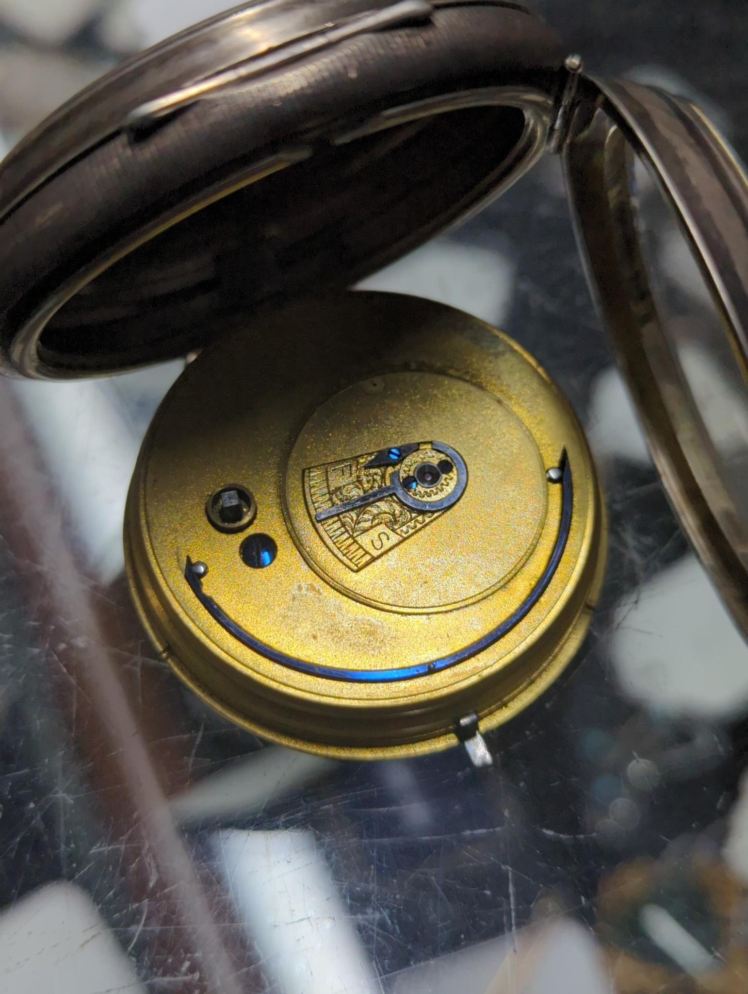 A George IV silver pair cased pocket watch by J. Levy & Son and two other pocket watches including one silver.